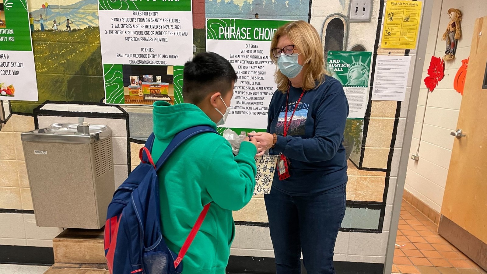 Karen Taylor interacts with a student at Big Shanty